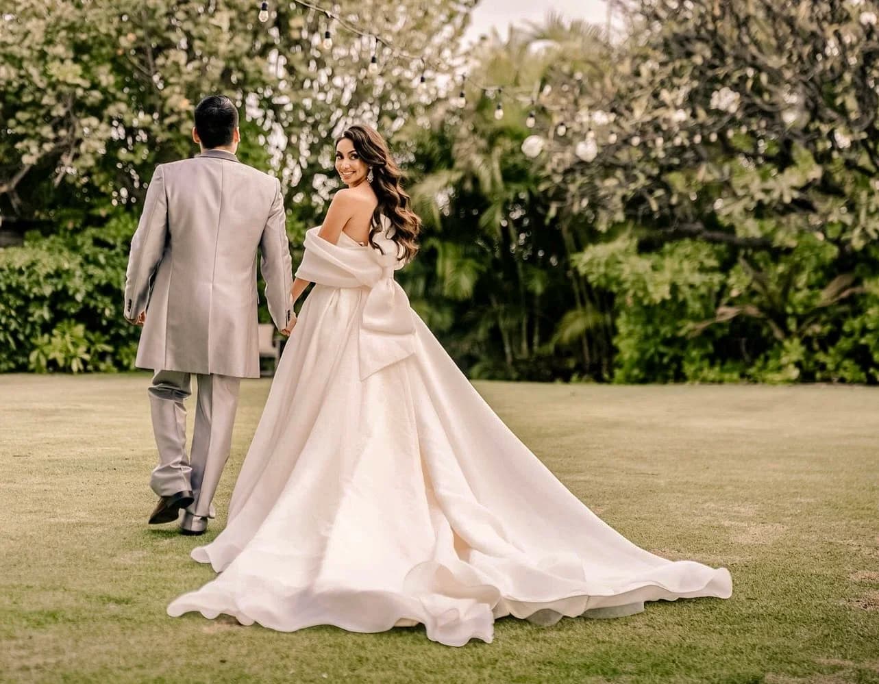 Bride and groom on the lawn at Kaimea Estates in Honolulu, Oahu